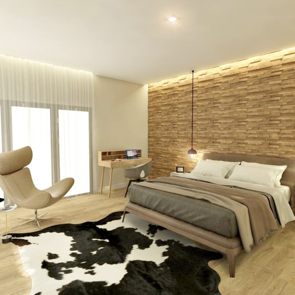 Descubre el dormitorio diseñado por Estudio Welfare en La Tahona, Canelones. Destacando un cabecero de madera y pisos claros, la moderna cama se complementa con una alfombra de cuero de vaca y una butaca Imola para relajarse junto al ventanal. Un pequeño escritorio nórdico y una TV en mueble flotante añaden funcionalidad sin sacrificar la ligereza del espacio. Disfruta de las vistas a los hermosos jardines desde el gran ventanal equinero.