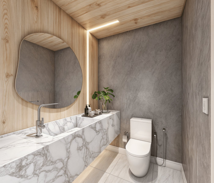 Baño privado con mesada de mármol, paredes de roble claro y moderna iluminación empotrada. Elegancia y comodidad en cada detalle